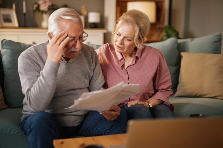 Senior couple reviewing documents